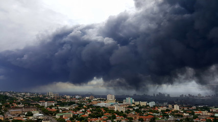 Thick dark grey pollution smog over the city of Durban.