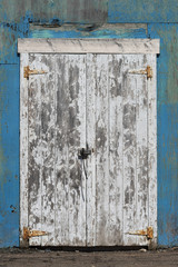 Weathered door and external walls of an abandoned building, Malpegue Bay, Prince Edward Island, Canada