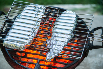 Food in aluminum Foil, Barbecue Grill cooking background
