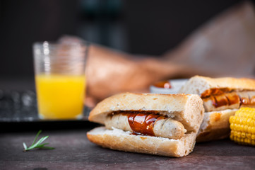 Sausage sandwich with brown/barbecue sauce