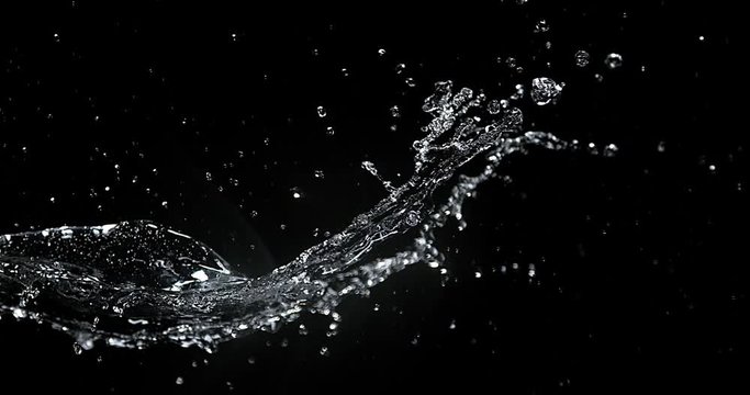 Water spurting out against Black Background, Slow motion 4K