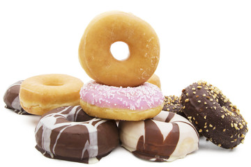 assorted donuts stacked and isolated on white background