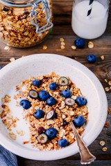 Healthy breakfast: oat granola with yogurt and fresh blueberries