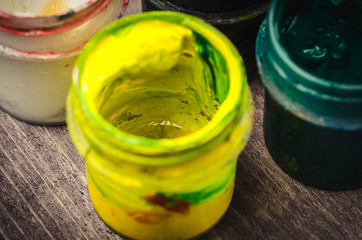 bank with yellow paint gouache/opened jar with yellow paint