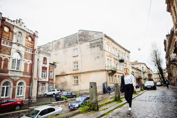 The beautiful lady walking along street