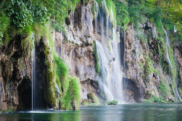 Fototapeta na wymiar Beautiful summer forest waterfall