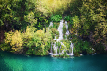 Fototapeta na wymiar Beautiful summer forest waterfall