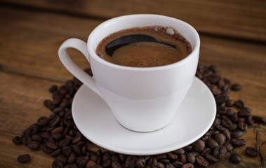 cup of black coffee on wooden background