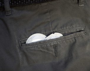 condoms in the pocket of his pants
