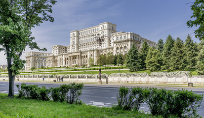 The facade of the imposing Parliament Building in Bucharest, Romania, on a sunny day