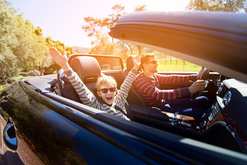 family in convertible car
