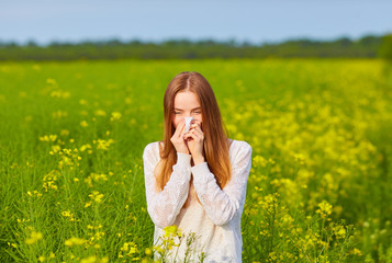 Young delightful female among field