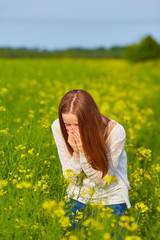 Fototapeta premium Young delightful female among field