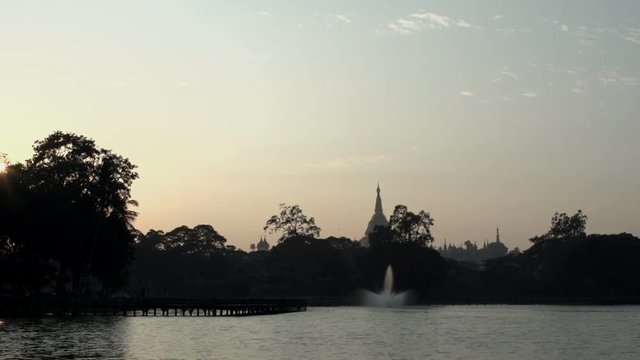 Sunset at Shwedagon Pagoda in Kandawgyi lake