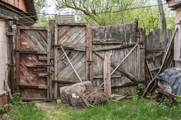 Old decaying wooden gate in the village