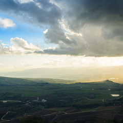 Magnificent view of the Golan Heights, the rays of the setting sun make their way through the clouds
