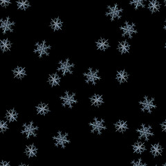 Naklejka na ściany i meble Seamless pattern with randomly placed cyan snowflakes on black background. This is real stellar dendrite snow crystals with elegant shapes, fine symmetry and long, ornate arms with many side branches.