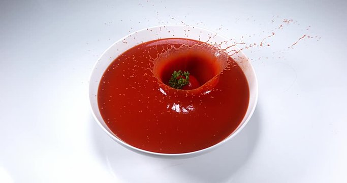 Cherry Tomatoe, solanum lycopersicum, Fruit falling into tomatoe's Juice, Slow Motion 4K