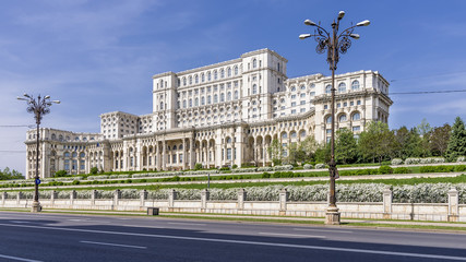 The facade of the imposing Parliament Building in Bucharest, Romania, on a sunny day