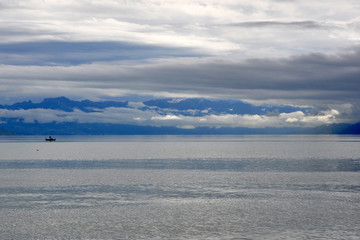 Blue sea , the horizon and away sailing boat blue