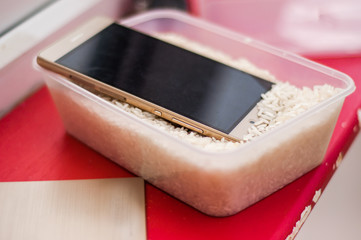 Phone drying in rice after water damage