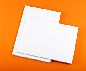 Blank flyer poster on orange background to replace your design.