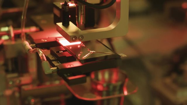 Touch Screen Production.
Production line of touch screen of mobile phone. Applying glue to stick the touch screen film to the glass module.
