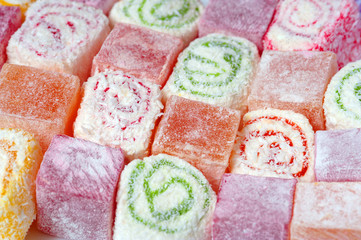 Set of assorted traditional eastern desserts. Arabian sweets on a metal dish. rahat lokum in a colorful plates. Selective focus