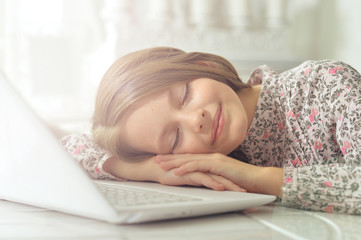Teenage girl using a laptop