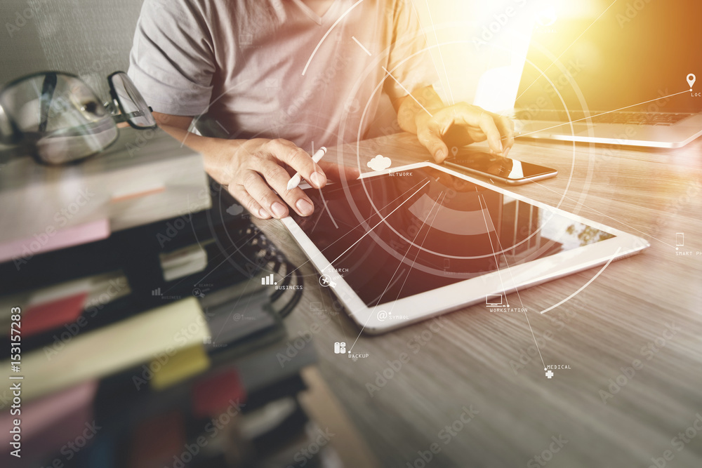 Poster businessman working with mobile phone and digital tablet and laptop computer on wooden desk in moder