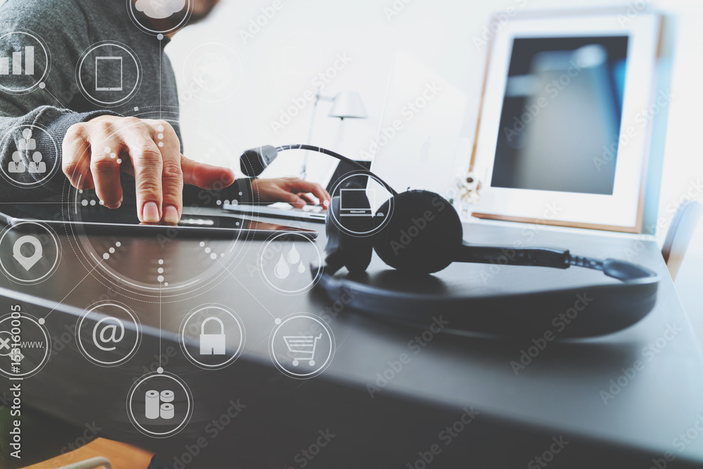 Aufkleber Man using VOIP headset with digital tablet computer as concept communication or it support or call center and customer service in modern office