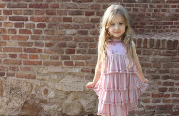 beautiful little girl posing in dress
