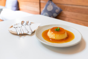 Pudding Caramel Custard (creme caramel)  in white plate on white table