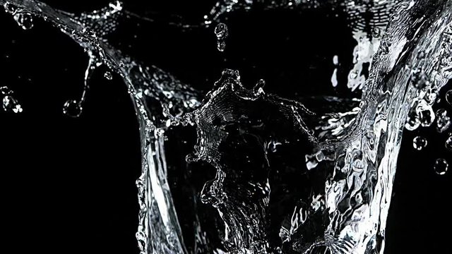Water spurting out against Black Background, Slow motion