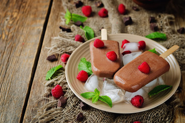 Chocolate banana ice cream with strawberries, mint and ices