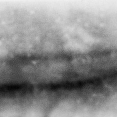 Abstract black and white grained film strip. Contains grain and light leaks. - 153182693