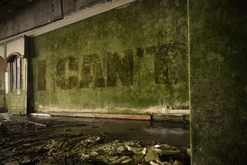 text i cant on the dirty wall in an abandoned ruined house