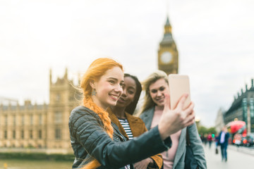 Girls taking a selfie with Big Ben in London