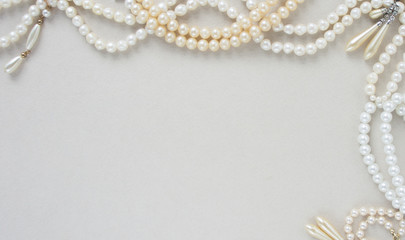Woman's Jewellery. Frame with old vintage pearl beads, pearl earrings. Beautiful vintage jewelry on...