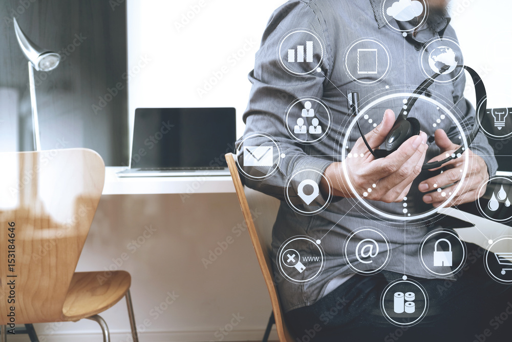 Aufkleber Man using VOIP headset with digital tablet and laptop computer as concept communication,it support,call center and customer service help desk with virtual icon diagram
