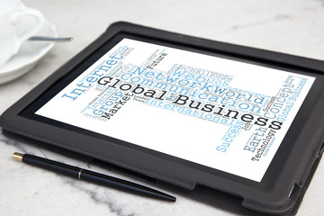 tablet with global business word cloud