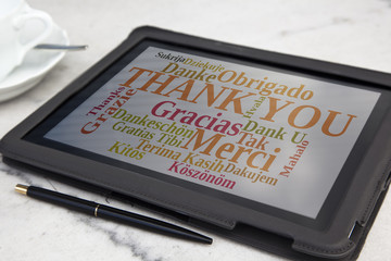 tablet with thank you word cloud