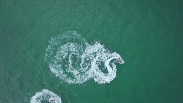 Cool aerial shot of two jet skis spinning in the middle of the ocean