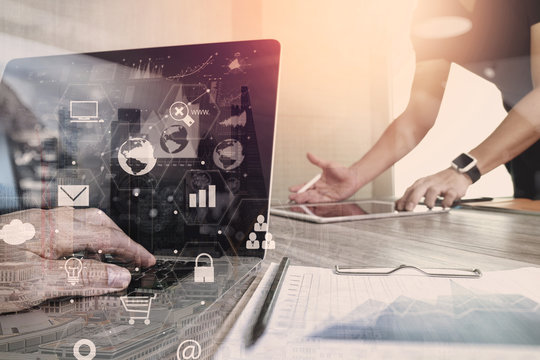 co working team meeting concept,businessman using smart phone and laptop and digital tablet computer in modern office with virtual interface icons network diagram - Powered by Adobe