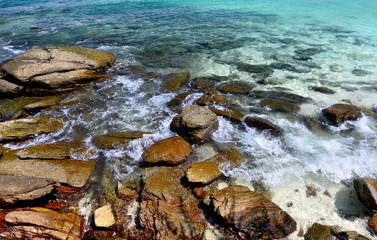 Rock in clear sea water.