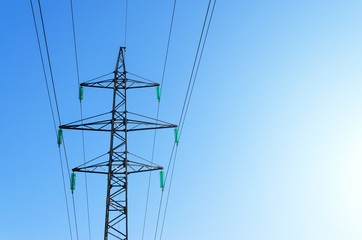 Power line support with high-voltage wires with exposure to the sun.