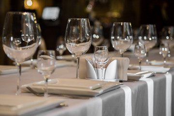 catering table set service with silverware, napkin and glass at restaurant before party