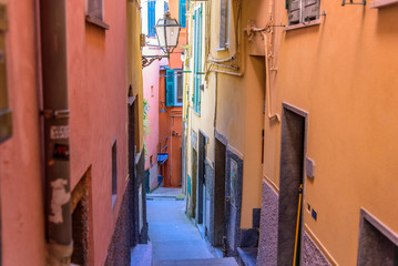 View of a street of the beautiful town Riomaggiore in Liguria, inside the famous Cinque Terre National Park.