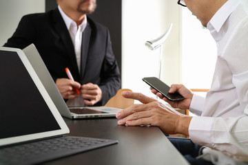 Fototapeta premium co working team meeting concept,businessman using smart phone and digital tablet and laptop computer in modern office