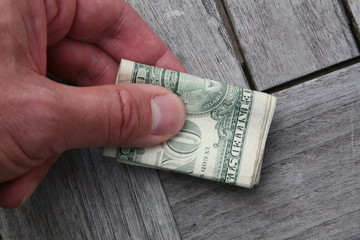 dollar banknotes in hand